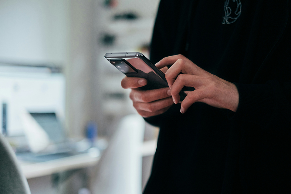 hands using a cell phone